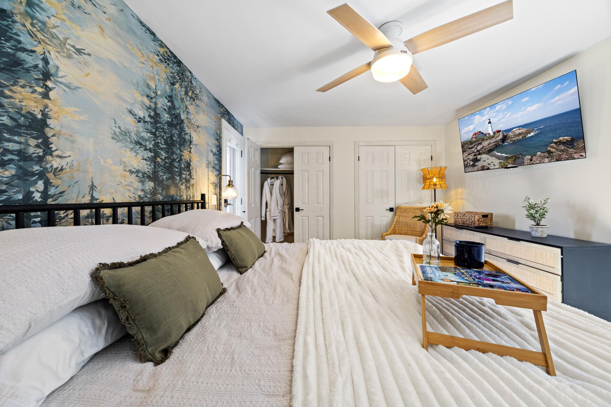 Primary bedroom with a forest mural at Eagles Nest