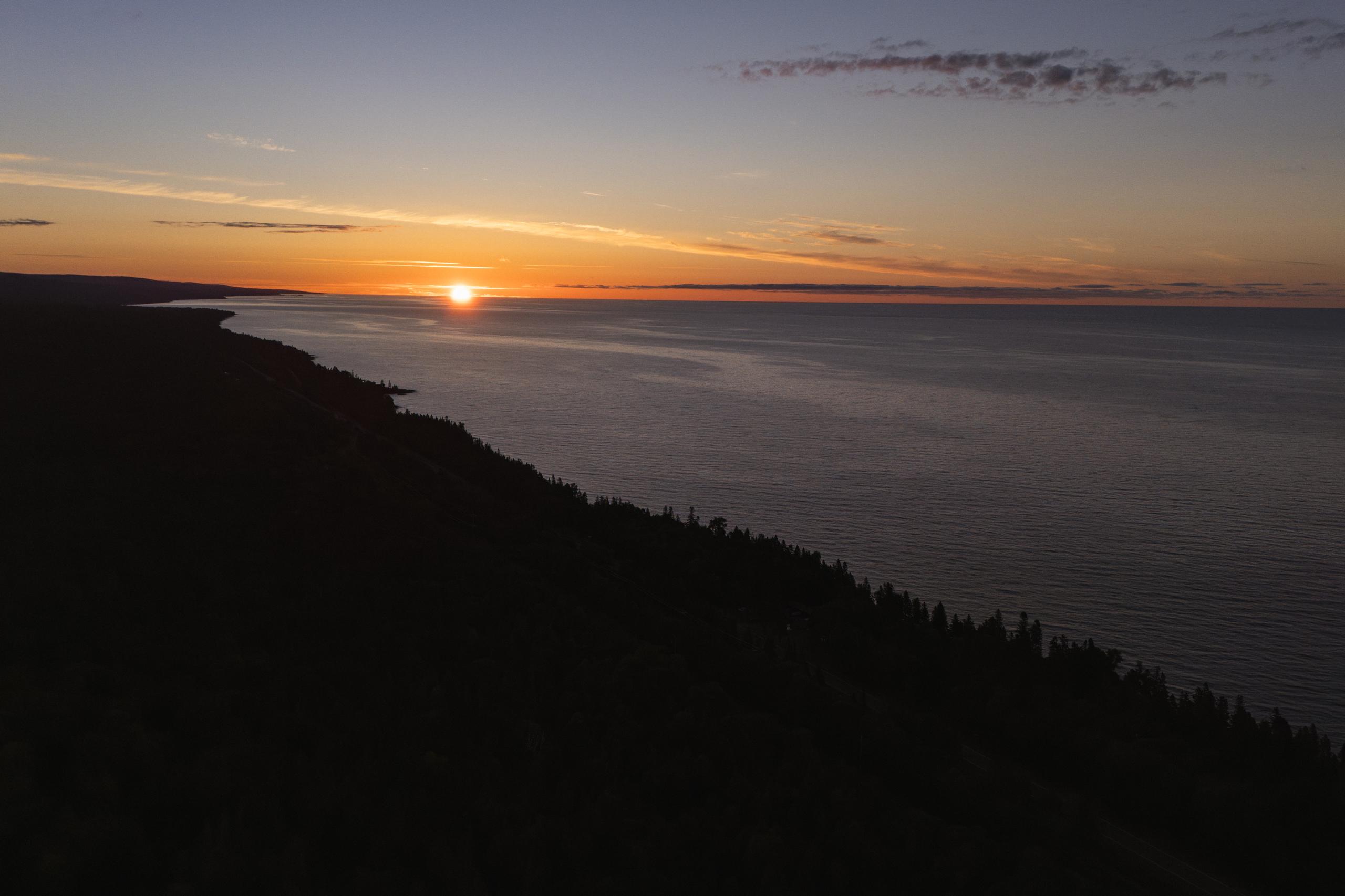 Aerial view of Nordhus Lodge with the sun setting over Lake Superior on Minnesota's North Shore