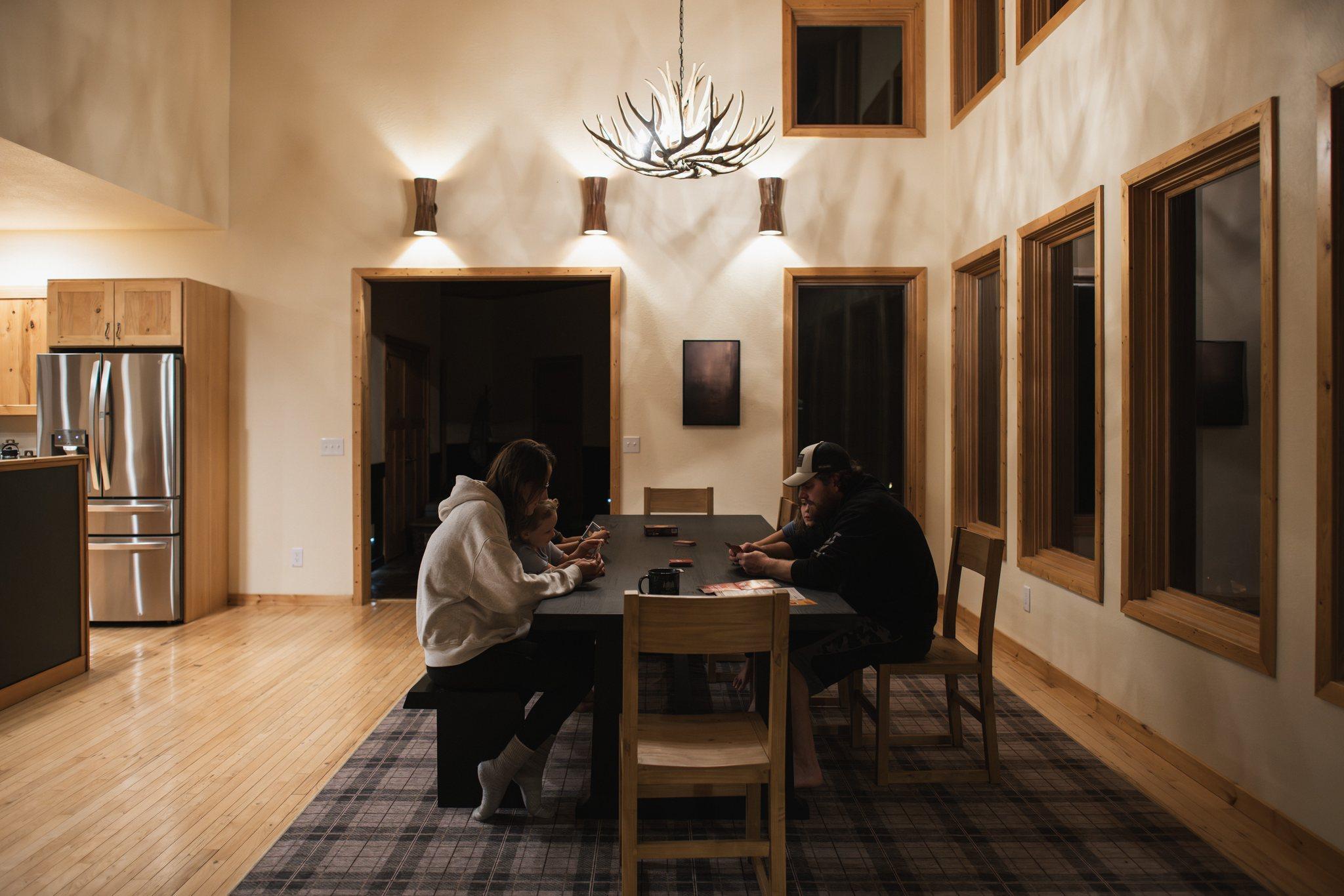 Guests gathered at the long dining table at Nordhus Lodge