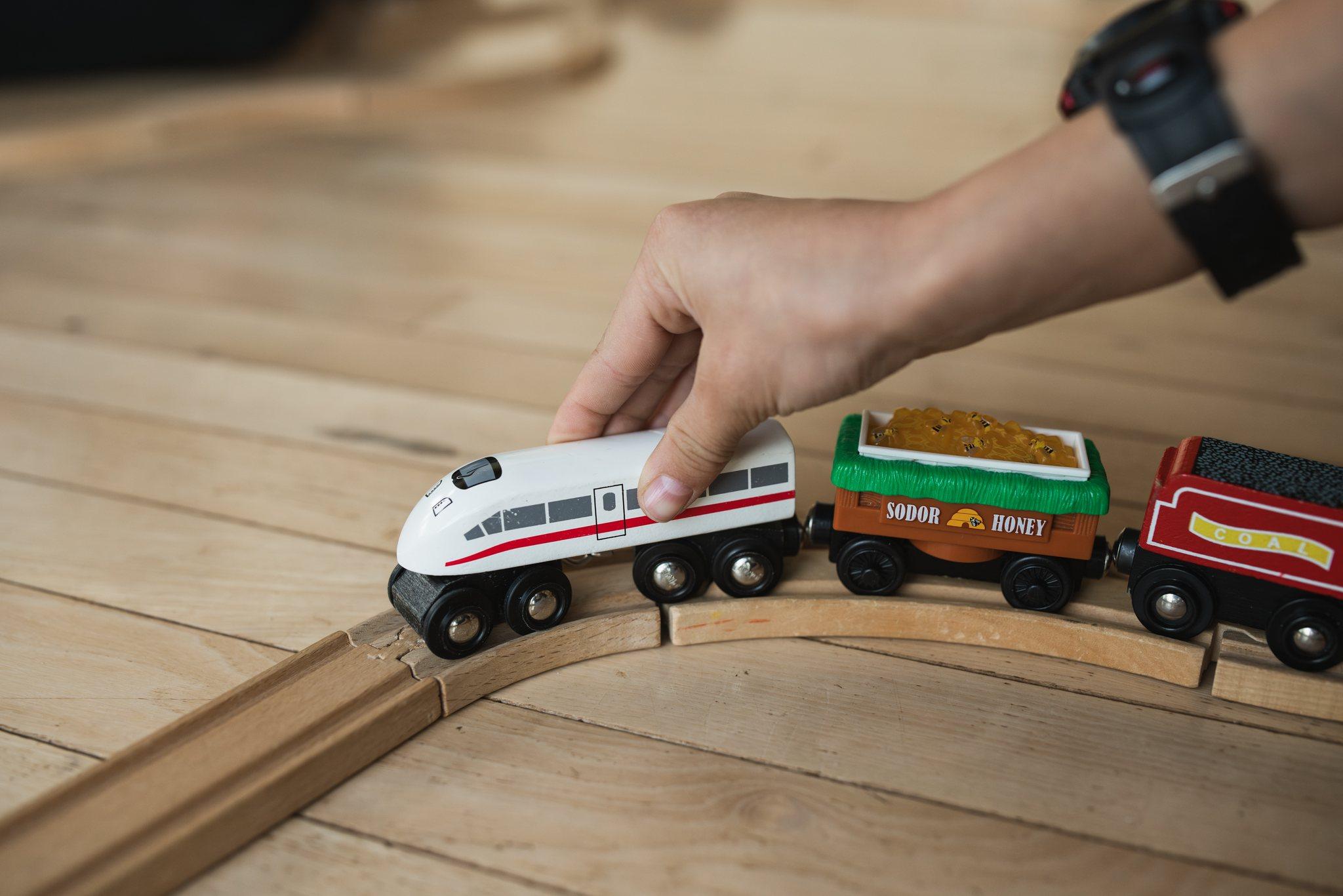 A child's wooden toy train on the floor at Nordhus Lodge