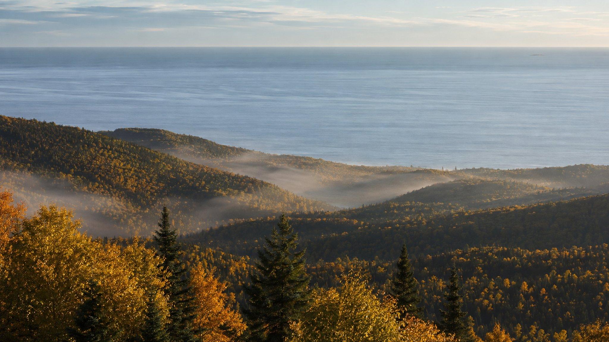 The Lutsen hills in autumn, mist in the valleys and Lake Superior beyond