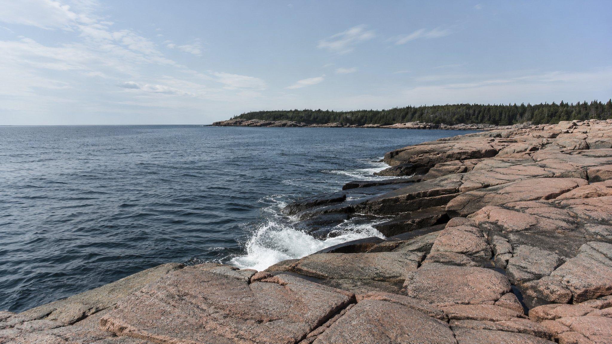 Surf breaking on pink granite ledge on the Schoodic Peninsula