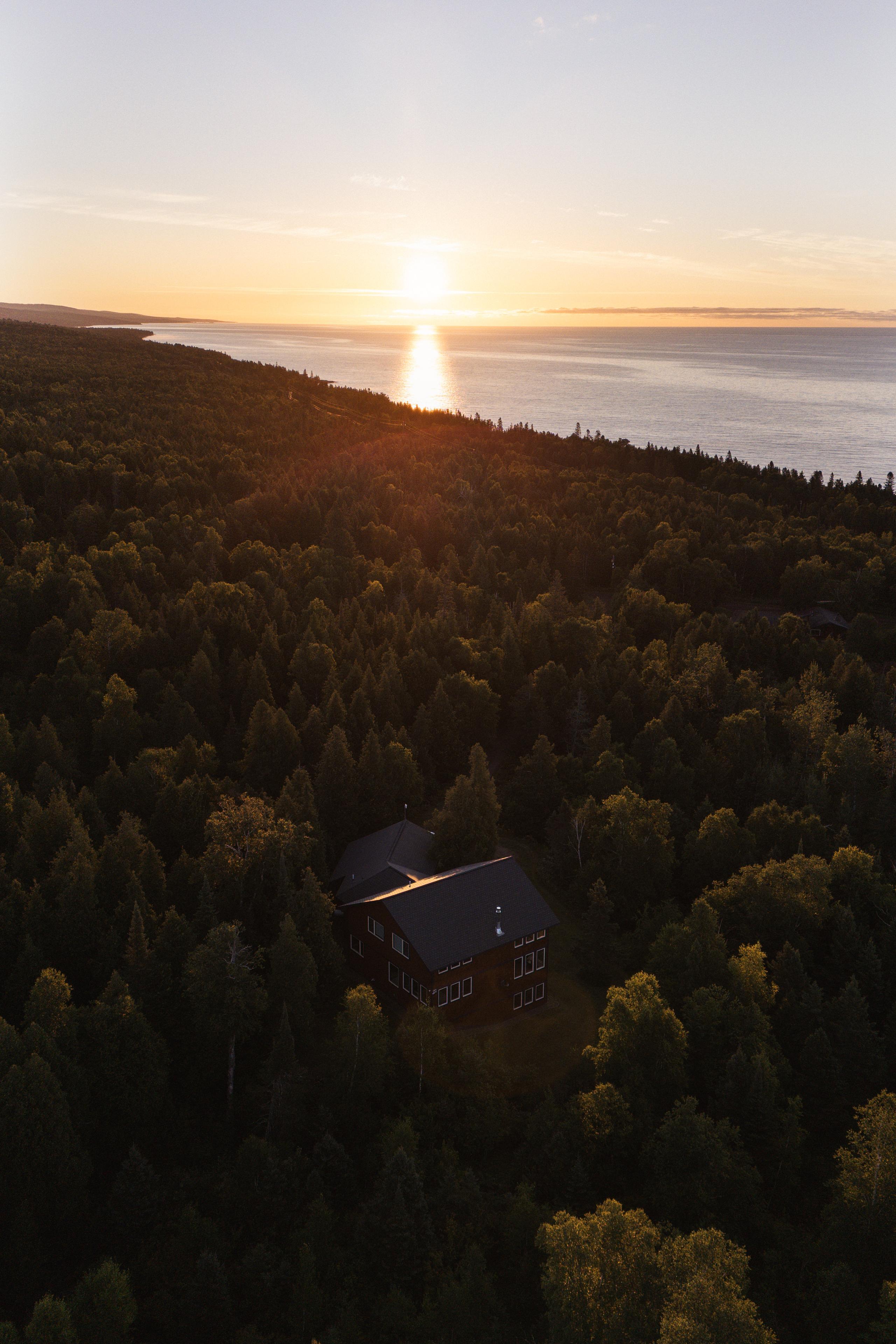 Lake Superior under a low sun, looking up the shore from above Nordhus Lodge