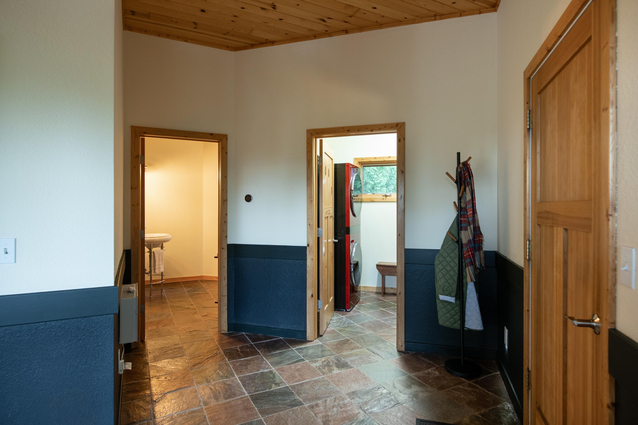 The great room at Nordhus Lodge, windows to the woods and lake